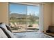 Relaxing bedroom view showcasing a patio with scenic views, accessible through a sliding glass door at 2214 W Muirfield Dr, Anthem, AZ 85086
