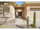 Inviting front entrance with desert landscaping, leading to a charming home with a covered walkway at 2214 W Muirfield Dr, Anthem, AZ 85086