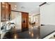 Beautiful kitchen featuring dark wood cabinets, stainless steel appliances, and a center island with bar seating at 2214 W Muirfield Dr, Anthem, AZ 85086
