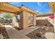 Quaint side entrance with a charming walkway and a delightful view of the lush backyard at 2214 W Muirfield Dr, Anthem, AZ 85086