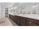 Bathroom featuring dual sinks, vanity, and quartz countertops at 2423 N Beverly Pl, Buckeye, AZ 85396