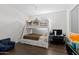 Comfortable bedroom features a wooden bunk bed and a desk area at 2423 N Beverly Pl, Buckeye, AZ 85396