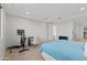 Bright bedroom features a workstation and exercise equipment at 2423 N Beverly Pl, Buckeye, AZ 85396