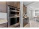 Modern kitchen with double ovens and stainless steel appliances for the home chef at 2423 N Beverly Pl, Buckeye, AZ 85396
