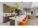 Stylish kitchen with a large island, quartz countertops, modern cabinets, and stainless appliances at 2423 N Beverly Pl, Buckeye, AZ 85396