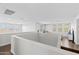 Second story loft area featuring lots of natural light and plenty of space for living and entertaining at 2423 N Beverly Pl, Buckeye, AZ 85396