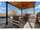 Outdoor kitchen area featuring a built-in grill, counter space and a wood pergola at 2423 N Beverly Pl, Buckeye, AZ 85396