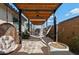 Relaxing outdoor patio features a ceiling fan, egg chair, and hammock at 2423 N Beverly Pl, Buckeye, AZ 85396