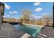 Backyard view of the pool and wrought iron fencing at 2423 N Beverly Pl, Buckeye, AZ 85396