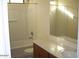 Clean bathroom featuring a shower-tub combo and a sink with vanity at 24930 W Dove Mesa Dr, Buckeye, AZ 85326