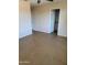 A vacant room featuring neutral walls, carpet flooring, and a ceiling fan at 24930 W Dove Mesa Dr, Buckeye, AZ 85326