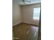 Inviting bedroom with a large window that allows for ample natural light and comfortable carpet flooring at 24930 W Dove Mesa Dr, Buckeye, AZ 85326