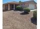 Charming single-story home featuring a well-maintained landscape and a covered porch at 24930 W Dove Mesa Dr, Buckeye, AZ 85326