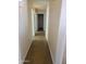 Hallway with neutral walls and flooring leading to other rooms at 24930 W Dove Mesa Dr, Buckeye, AZ 85326