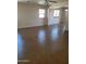 Spacious living room with ample natural light through the windows at 24930 W Dove Mesa Dr, Buckeye, AZ 85326