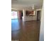 Open floorplan with living and kitchen area, ceiling fan, and sliding glass door at 24930 W Dove Mesa Dr, Buckeye, AZ 85326