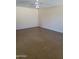 Spacious living room with polished concrete floors, natural light, and a ceiling fan at 24930 W Dove Mesa Dr, Buckeye, AZ 85326
