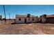 Spacious backyard with gravel cover, fencing, and the back of the home at 2502 W Jefferson St, Phoenix, AZ 85009