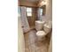 Bathroom featuring tile floors and shower, with a toilet and sink at 2502 W Jefferson St, Phoenix, AZ 85009