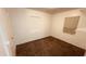 Carpeted bedroom with neutral walls and window and closet at 2502 W Jefferson St, Phoenix, AZ 85009