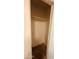 Small walk-in closet with a neutral paint and rod for hanging clothes at 2502 W Jefferson St, Phoenix, AZ 85009