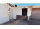 An old, weathered shed with a detached door reveals a glimpse of its interior, hinting at possible storage needs at 2502 W Jefferson St, Phoenix, AZ 85009