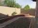 The backyard features low maintenance desert landscaping and a block fence at 2637 S 156Th Ave, Goodyear, AZ 85338