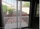 View of a backyard featuring low brick walls and well-maintained landscaping at 2637 S 156Th Ave, Goodyear, AZ 85338