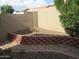 Private backyard featuring low-maintenance desert landscaping and mature trees at 2637 S 156Th Ave, Goodyear, AZ 85338