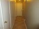 Hallway featuring tile floors, neutral paint, and white doors at 2637 S 156Th Ave, Goodyear, AZ 85338