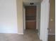 Hallway area that shows built-in cabinets and neutral walls at 2637 S 156Th Ave, Goodyear, AZ 85338