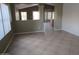 Bright living room featuring tile floors and neutral paint, creating a welcoming space at 2637 S 156Th Ave, Goodyear, AZ 85338