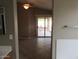 Open living room with tile flooring, ceiling fan, and sliding glass doors to the patio at 2637 S 156Th Ave, Goodyear, AZ 85338