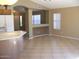 Open living room with neutral walls, tile floors, and arched doorway at 2637 S 156Th Ave, Goodyear, AZ 85338