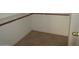 Walk-in closet with tile floors, white walls, and wood shelving at 2637 S 156Th Ave, Goodyear, AZ 85338