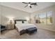 Bright bedroom with a comfortable bed, a large window, and a neutral color palette at 29216 N 71St Dr, Peoria, AZ 85383