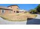 Expansive backyard showcasing a spacious lawn, perfect for outdoor activities and relaxation at 2987 E Powell Way, Gilbert, AZ 85298