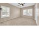 Bedroom with plush carpet and bright, shuttered windows at 2987 E Powell Way, Gilbert, AZ 85298