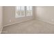 Bedroom with plush carpet and bright, shuttered windows at 2987 E Powell Way, Gilbert, AZ 85298