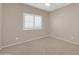 Cozy bedroom featuring carpet and a bright window at 2987 E Powell Way, Gilbert, AZ 85298