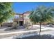 Charming two-story home with stucco exterior, tile roof, and well-maintained landscaping at 2987 E Powell Way, Gilbert, AZ 85298