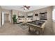Relaxing game room with a pool table, sectional sofa, and ceiling fan at 2987 E Powell Way, Gilbert, AZ 85298