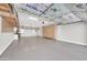 Spacious garage featuring abundant storage, finished ceiling and a sink for added convenience at 2987 E Powell Way, Gilbert, AZ 85298