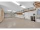 Spacious garage with custom storage and a wash basin for convenience and efficient organization at 2987 E Powell Way, Gilbert, AZ 85298