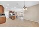 Open kitchen with granite countertops, stainless steel appliances, and adjacent dining space at 2987 E Powell Way, Gilbert, AZ 85298