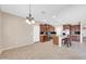 Kitchen features wooden cabinetry, island with bar stool seating, and pendant lighting at 2987 E Powell Way, Gilbert, AZ 85298