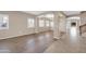 Open-concept living area features tile transitioning into wood-look flooring at 2987 E Powell Way, Gilbert, AZ 85298