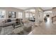 Open-concept living space with modern furniture, archways, and multiple seating areas at 2987 E Powell Way, Gilbert, AZ 85298