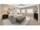 Serene main bedroom features a neutral palette, large windows, and a sitting area at 2987 E Powell Way, Gilbert, AZ 85298