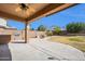 Outdoor patio with built-in BBQ, firepit, and ample space for entertaining in your backyard at 2987 E Powell Way, Gilbert, AZ 85298